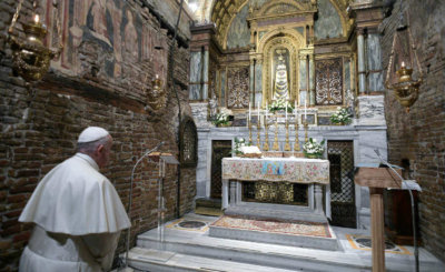 Pope Francis prays before a statue of Our Lady of Loreto at the Sanctuary of the Holy House on the feast of the Annunciation in Loreto, Italy, March 25, 2019.